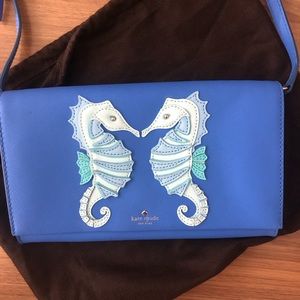 Kate Spade blue envelope crossbody bag with seahorse pattern